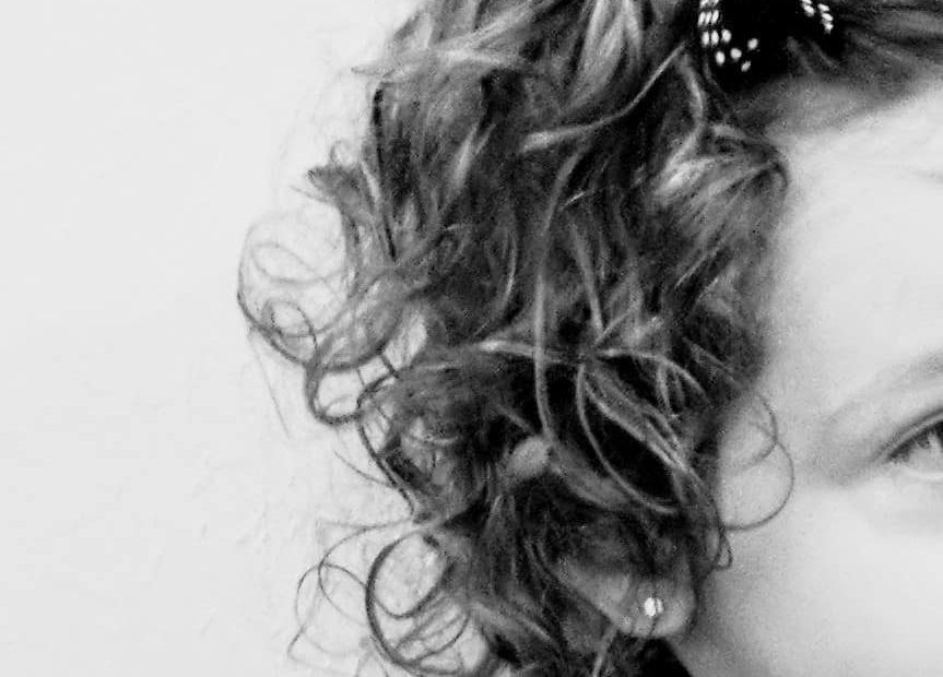 little girl with curly hair