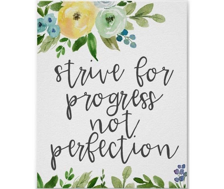 a hand written card that says "strive for progress not perfection"