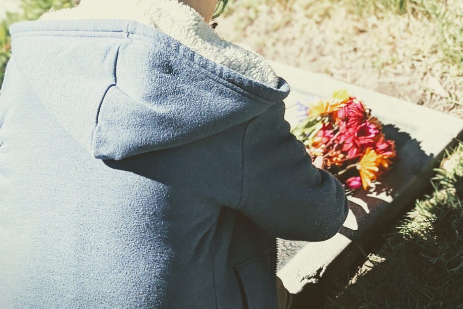 young boy at gravesite