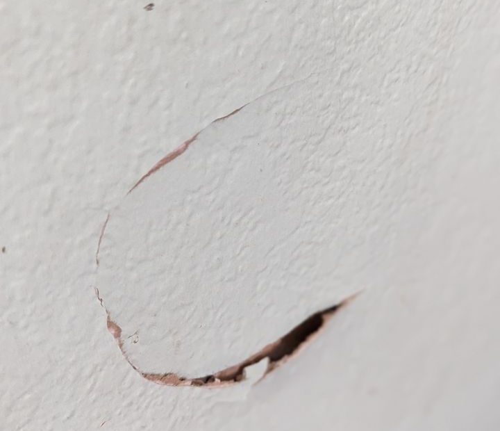 image of wall with hole in it